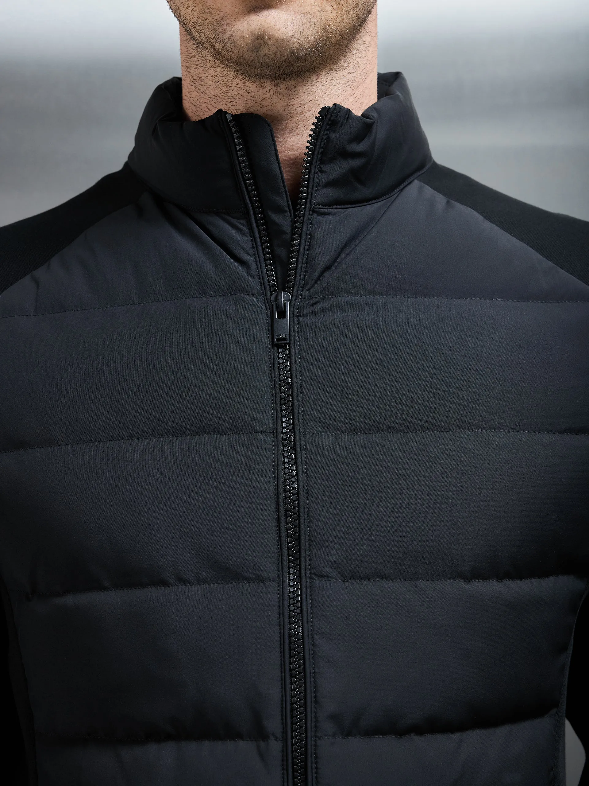 Hybrid Technical Puffer Jacket in Black